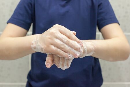 Global Handwashing Day Concept/Washing of hands with soap in bathroom.の写真素材
