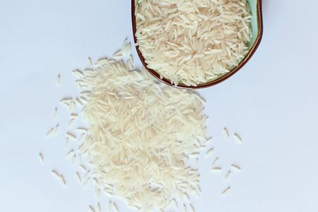 Rice in a bowl on a white background