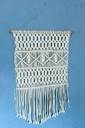 Wall panel in the style of Boho made of cotton threads in natural color using the macrame technique...