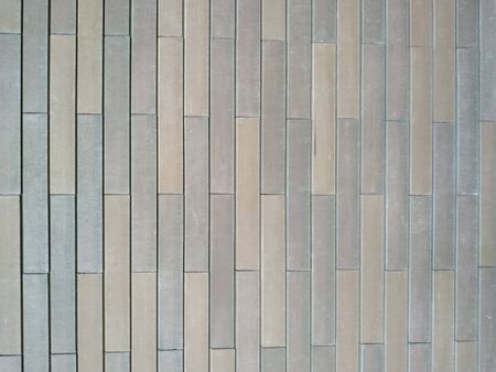 Brown brick wall. the vertical frame. the texture of the brick.
