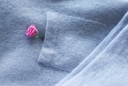 Knitted cardigan in pastel color, garment details, jacket pocketの写真素材