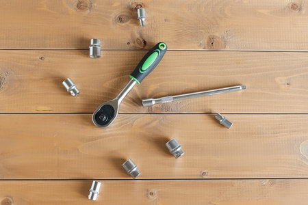 A multipurpose precision tool kit set box showing wrenches with different interchangeable bit head sizes arranged in rows to cater to varying types of screws, nuts and bolt types - closeup top view.の写真素材