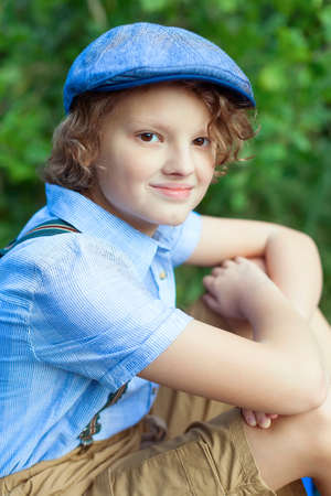 Portrait Of Young Smiling Teen Boy. walking in the park