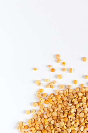 Dry yellow peas close-up on a light background. Layout for grocery departments, packaging of peasの写真素材