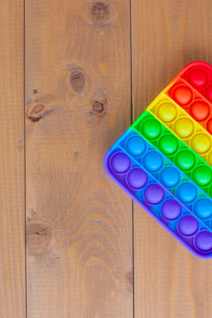 Top view of the new sensory toy-rainbow . Anti-stress toy for children and adults.A colorful toy