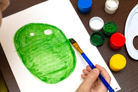 Cute little preschooler child drawing at homeの写真素材