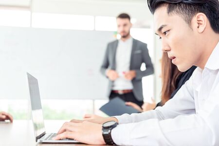 Teamwork business concept .Start up business people in modern office, working together having success. Multi ethnic start-up business team on meeting in modern bright office interior brainstorming .の写真素材