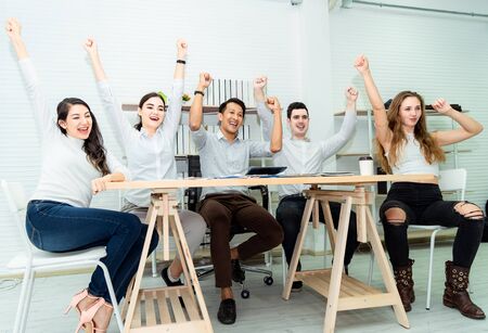 Teamwork of young asian business people working success smart deal and celebrate in modern...