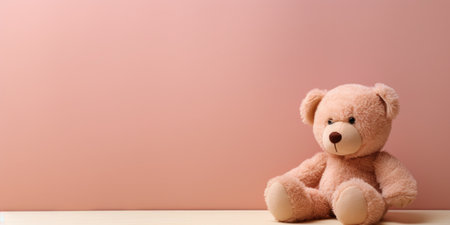 Cute teddy bear isolated on soft pastel background, with copy space for ads and textの素材