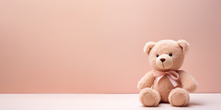 Cute teddy bear isolated on soft pastel background, with copy space for ads and textの素材