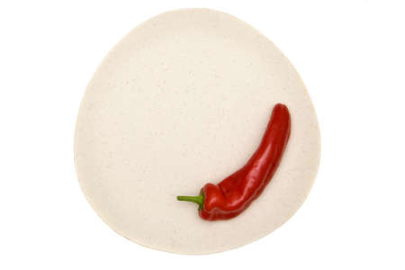 Isolated red pepper on a decorative plateの写真素材