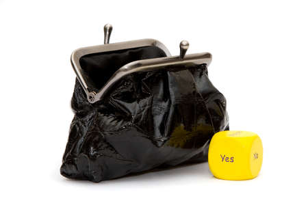 Isolated black purse with yellow Yes diceの写真素材