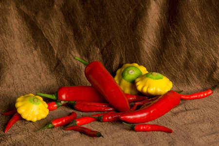 Composition with pepper and patisons on a brown backgroundの写真素材