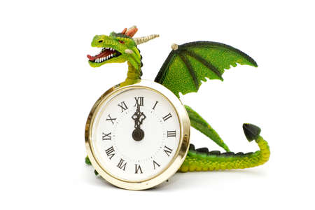 Dragon and clocks isolated on white の写真素材