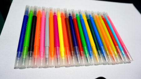 Colorful pens on a white background. Selective focus. Close-up.の写真素材