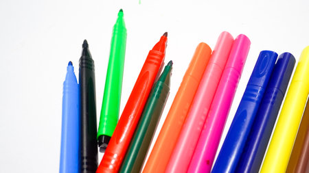 Colorful felt-tip pens on a white background close up.の写真素材