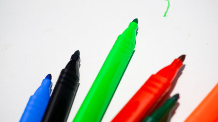 Colorful markers on a white background, close-upの写真素材