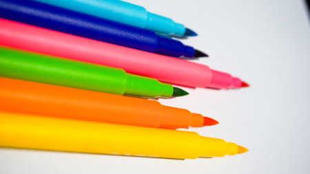 Colored felt-tip pens on a white background close-upの写真素材