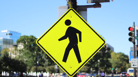 Walking signpost on the streetの写真素材