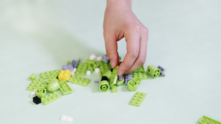 Assemble a block of toyの写真素材