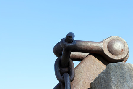 Large metal chains against the blue sky