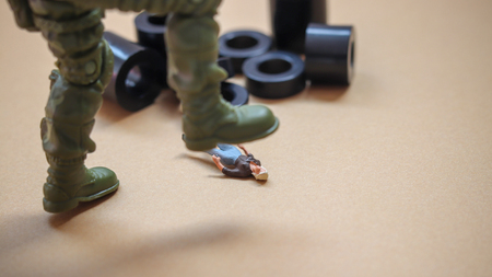 The concept of the trampled women's human rights. A lying woman of miniature.の写真素材