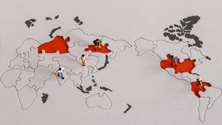 World maps and miniature people. Diverse peoples concepts around the world.の写真素材