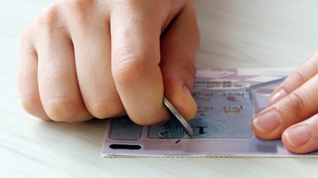 Hands scratching an instant lotteryの写真素材