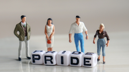 Alphabetic white cube of PRIDE. Standing miniature people behind the alphabet cube.の写真素材
