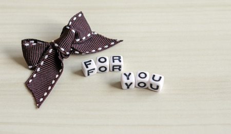 FOR YOU text and brown ribbon.