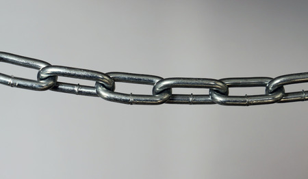 A silver metal chain laterally.