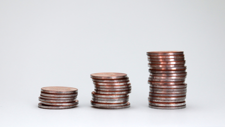 Three piles of different heights coins.の写真素材