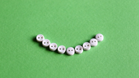 White button on the light green background.