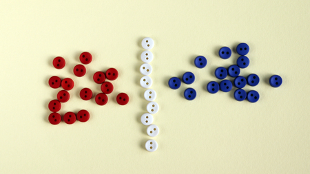 Blue button and red button with a white button in between.