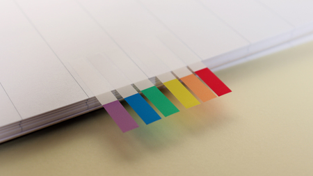 Empty notebook and rainbow colored label.の写真素材