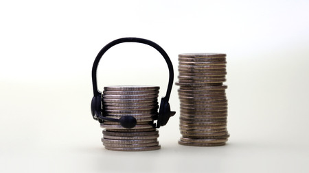 A pile of coins wearing a headset and a pile of coins.