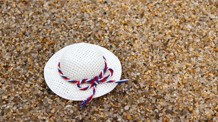 A white hat on the sand.の写真素材