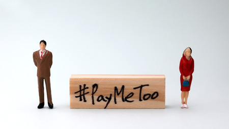 Wooden block written as #PAYMETOO. The social movement for equal share.の写真素材