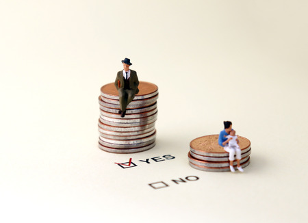 YES and NO check boxes with red check mark in the YES box. A miniature man sitting on a pile of...