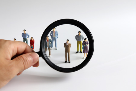 Magnifier and miniature people.の写真素材