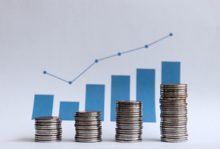 Piles of coins placed at different levels.