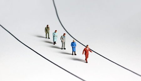 Miniature people walking on the street.の写真素材