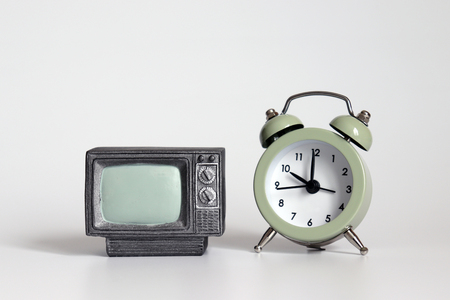 An alarm clock side by side miniature television.の写真素材