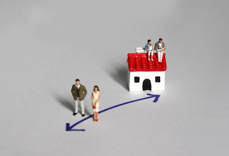 Miniature people. The people's concepts of giving birth and not giving birth.の写真素材