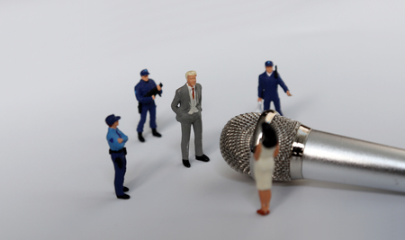 The concept of social discrimination. Miniature people.の写真素材