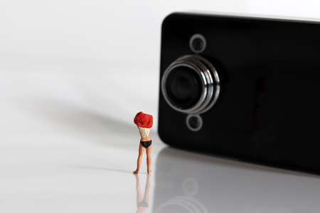 Miniature people. The concept of serious hidden camera crime.の写真素材