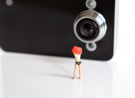 Miniature women. The concept is that illegal filming is a serious crime.