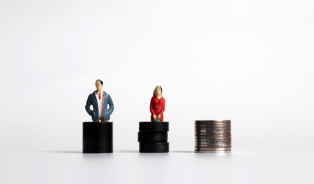 The concept of equal employment opportunity. Miniature woman with a miniature man.の写真素材