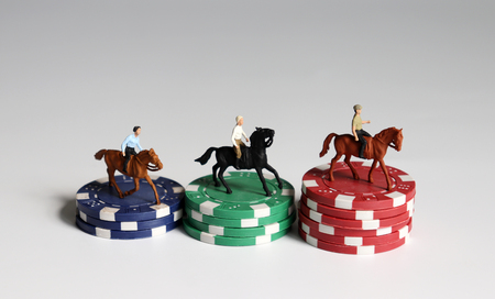 Miniature of horse rider on pile of casino chip.の写真素材