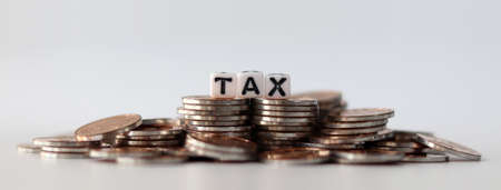 many coins, and tax on background.の写真素材